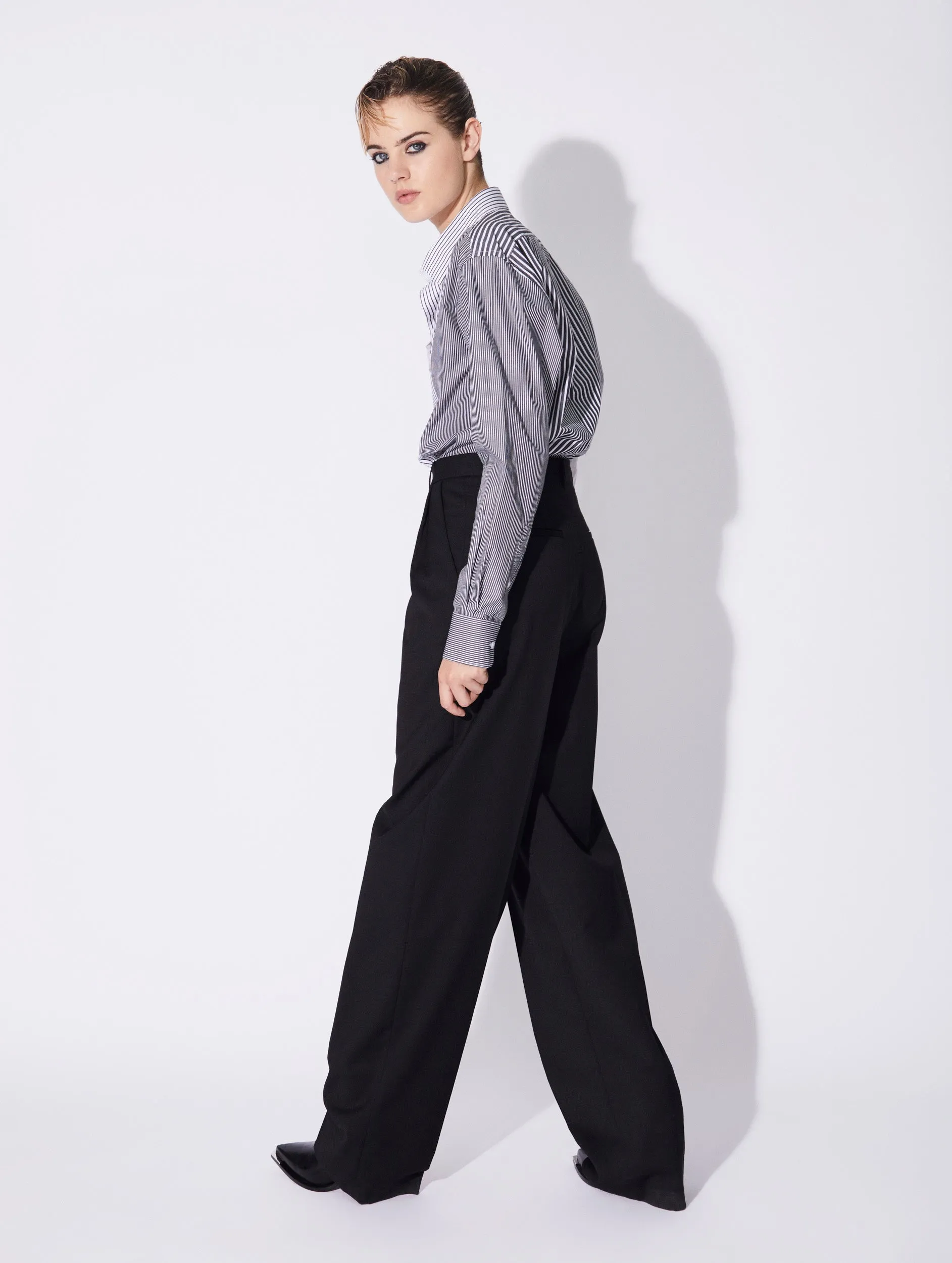 Black stretch wool high waisted pleated trousers